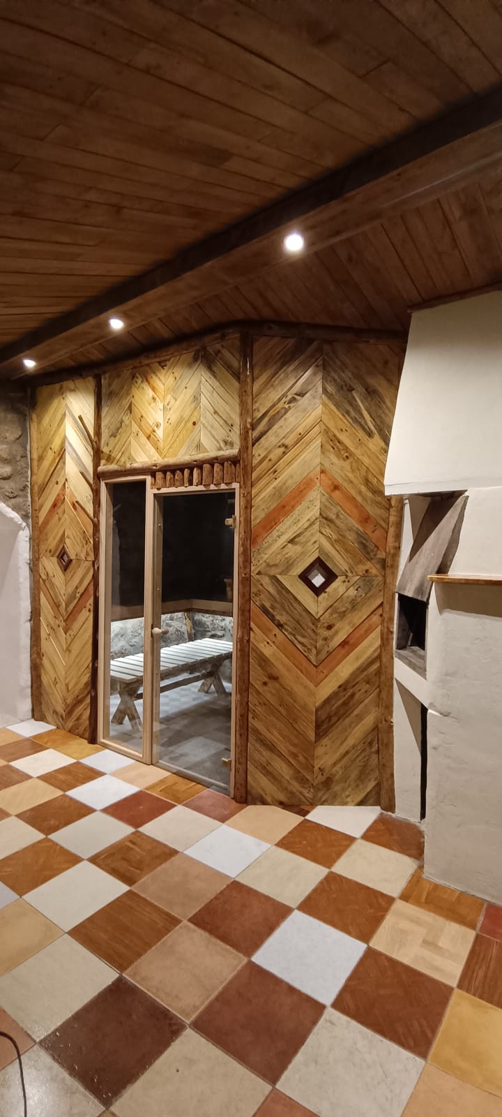 Warm timber entrance inside a Sauna Temple